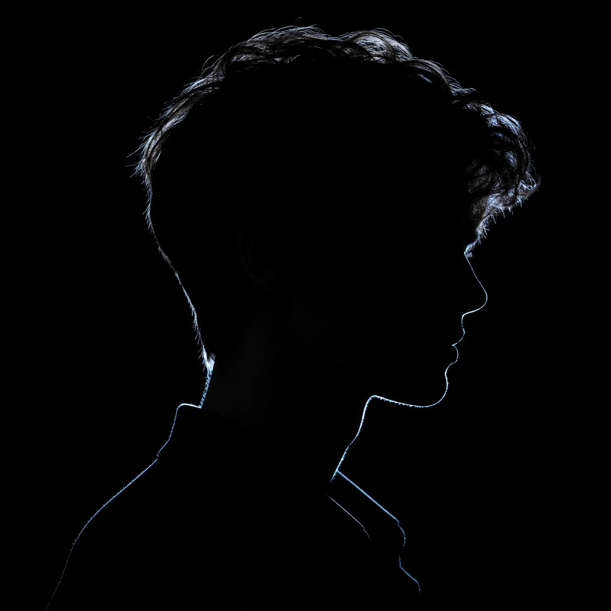 Dark aesthetic black pfp silhouette portrait with soft rim light and deep shadow for a moody, mysterious Instagram avatar