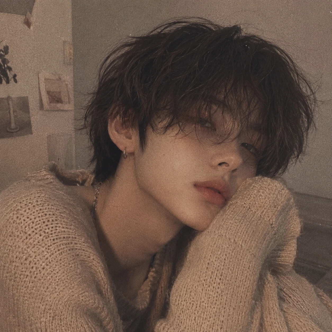 Aesthetic femboy profile picture with soft film grain and beige knitwear