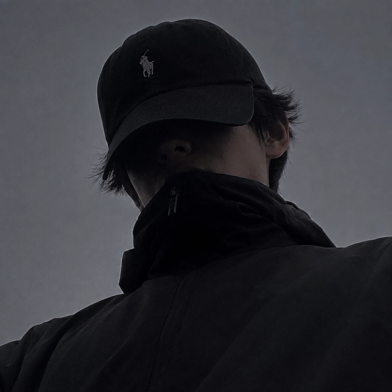 Low-angle portrait with black cap for unknown boy pfp.