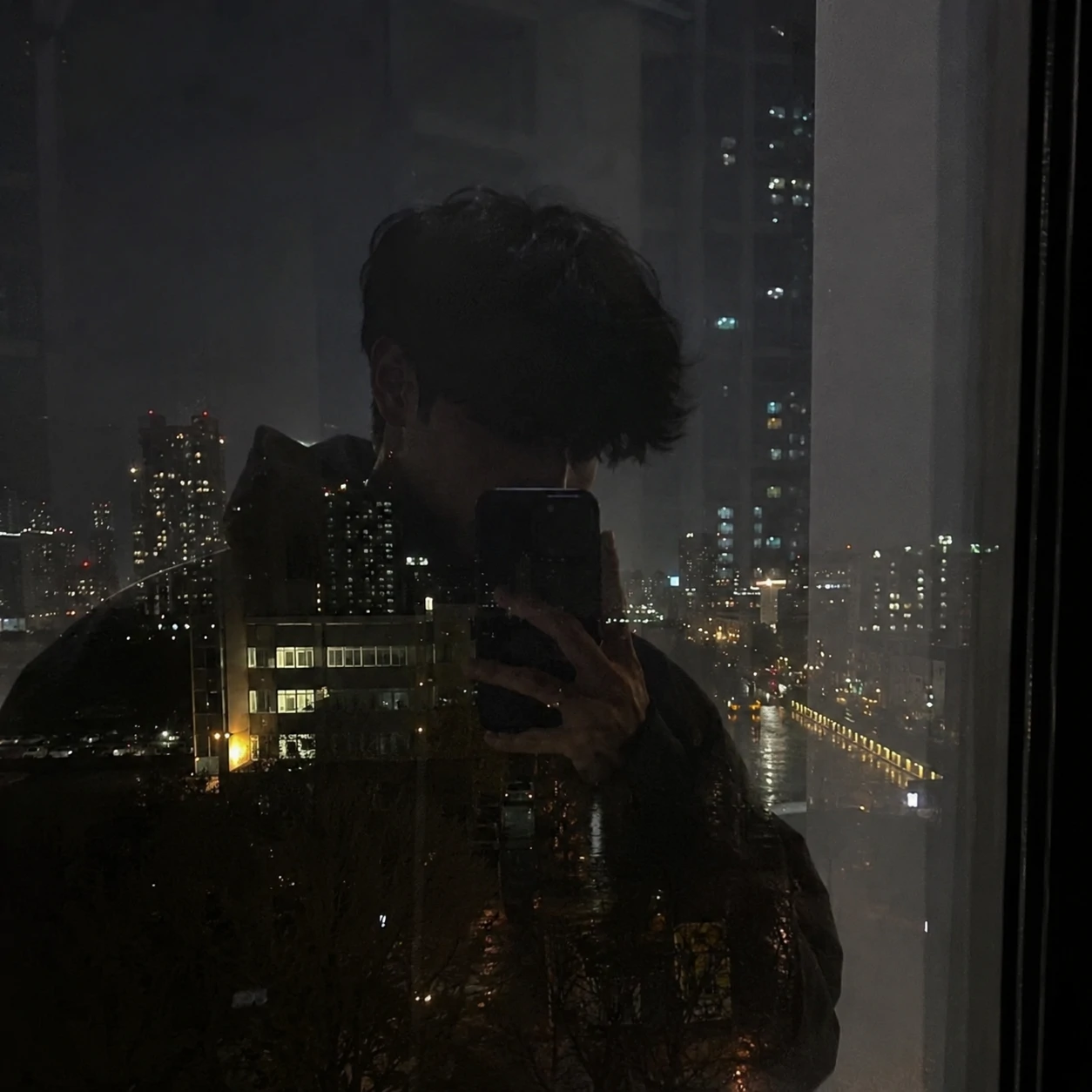 Night reflection portrait in a window for unknown boy pfp.