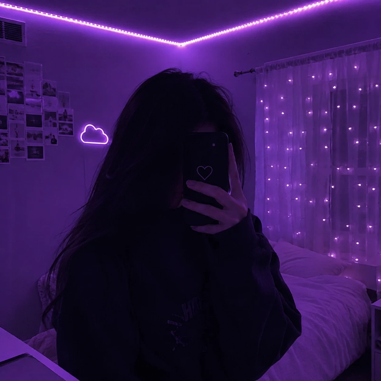 Girl silhouette in purple room light for an unknown girl pfp.