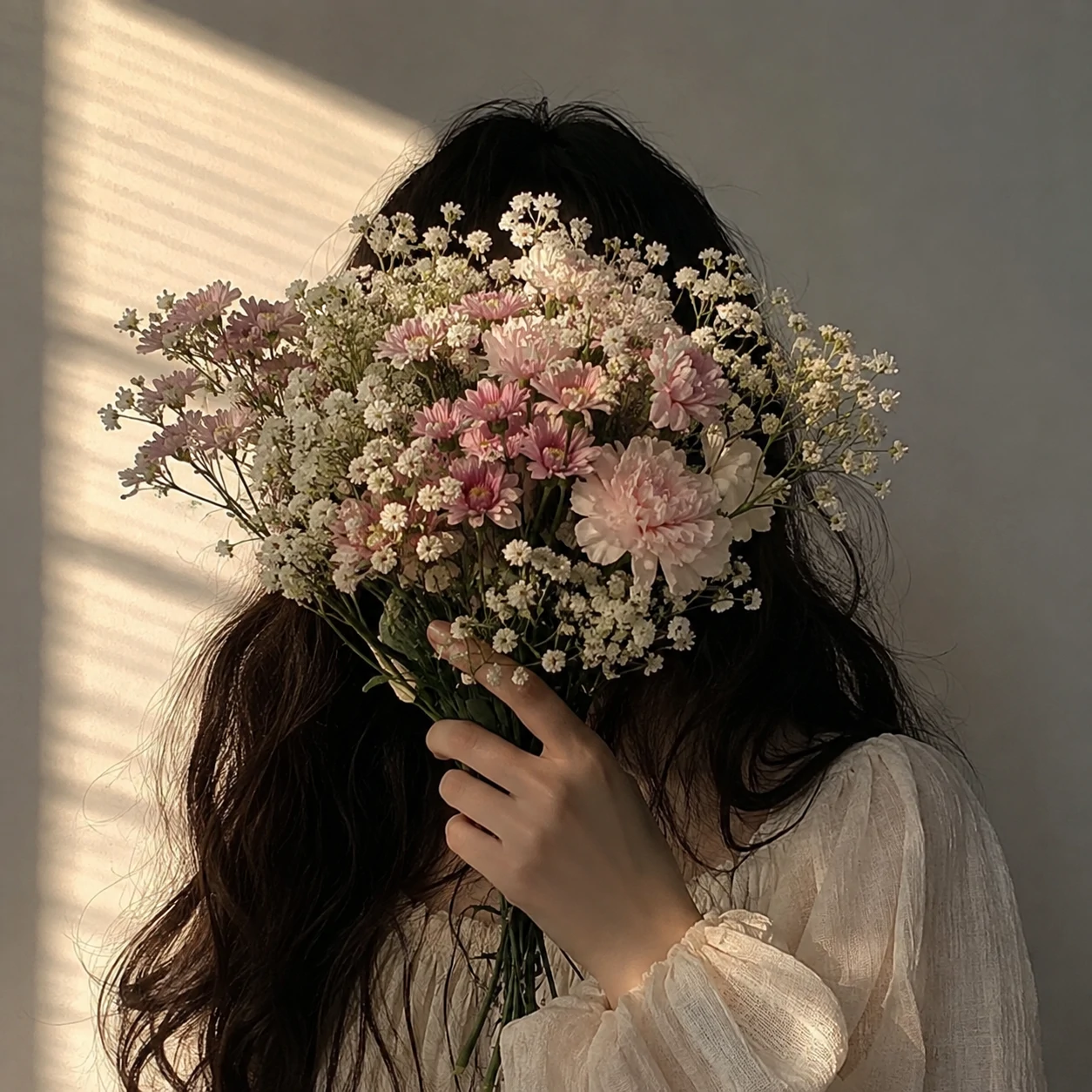 Face hidden behind flowers for unknown Instagram pfp use.